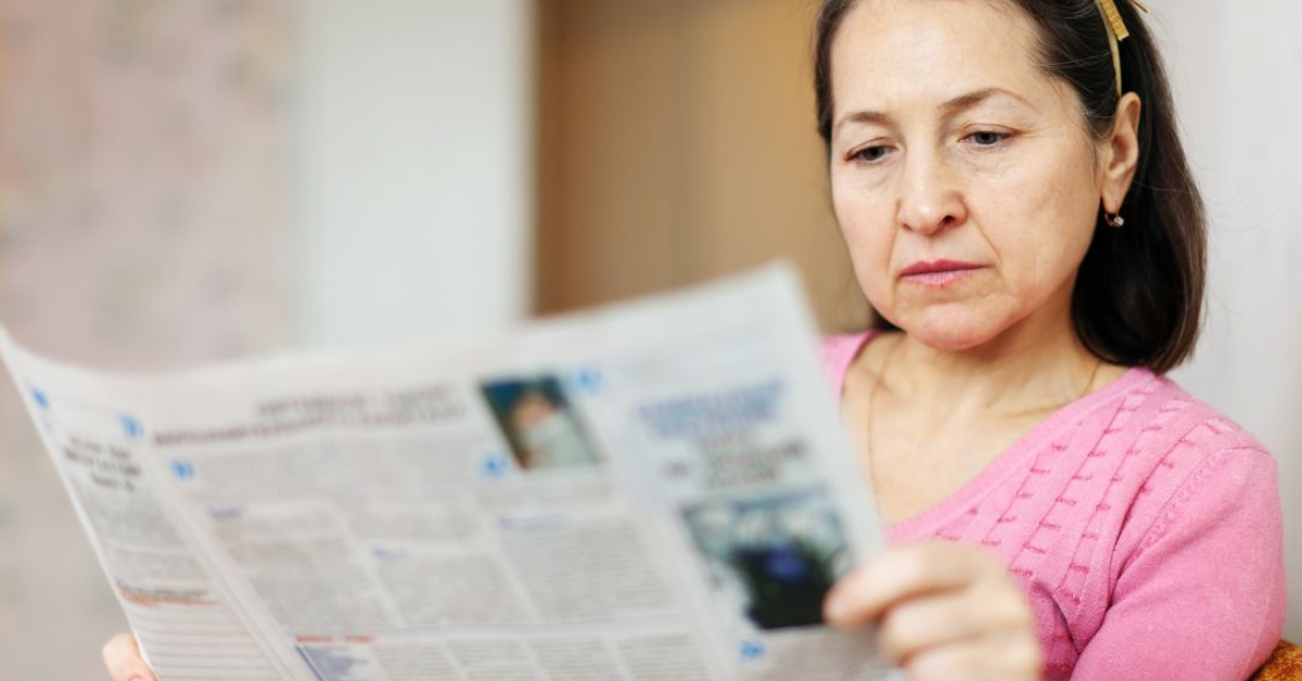 Women reading newspaper